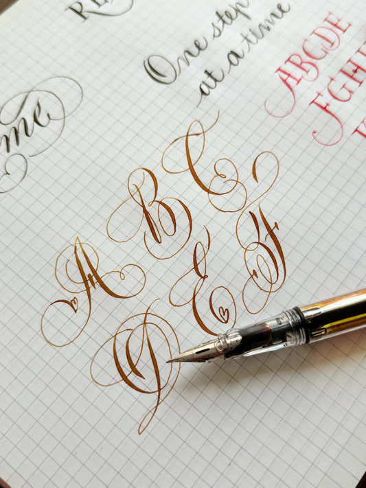 Calligraphy practice on grid paper with a pen