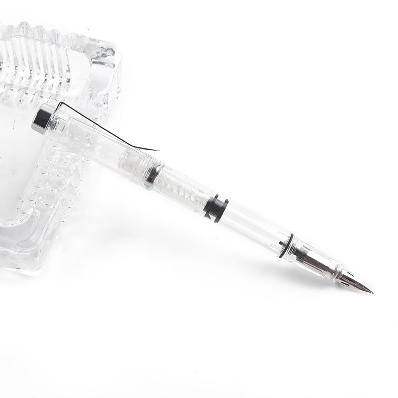 Clear pen with metallic tip 