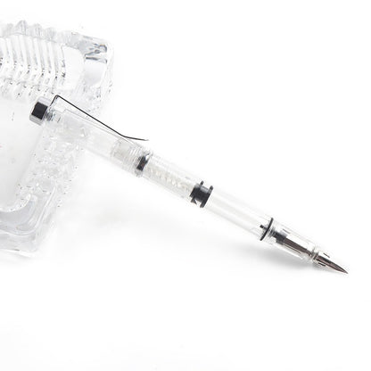Clear pen with metallic tip 
